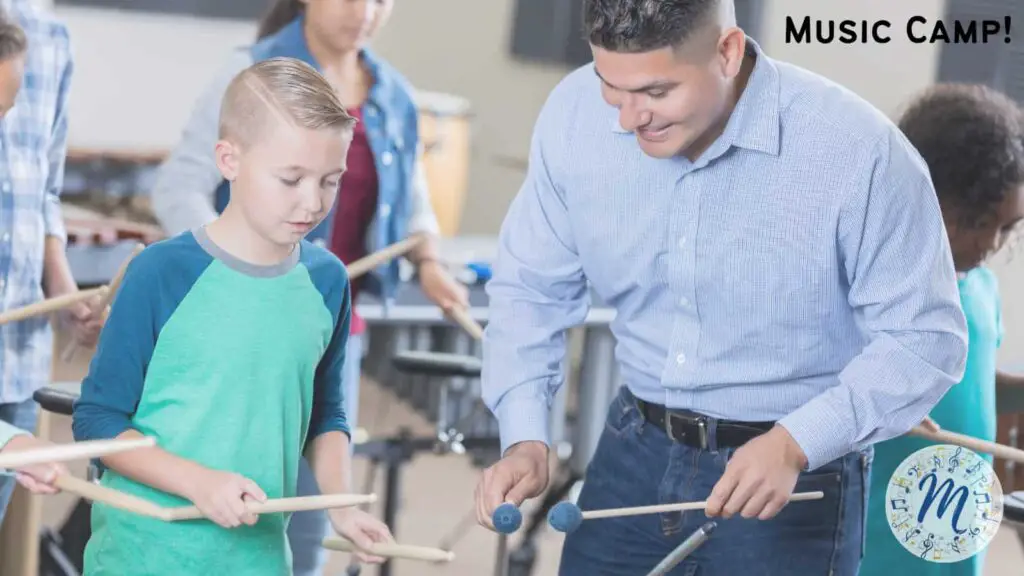 Music teacher teaching percussion student how to use drum sticks