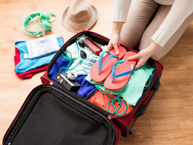 Packing bag for band camp flip flops on top. 