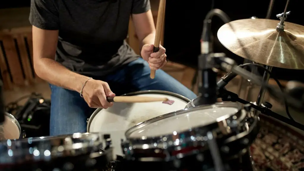 Professional drummer playing drums and cymbals