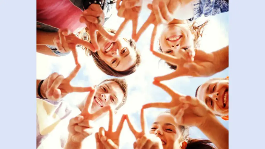 Group of friends making a star with their fingers