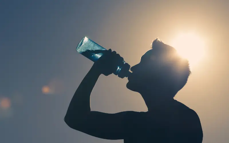 boy drinking water to stay healthy
