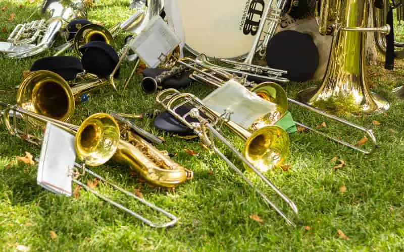 Marching band instruments laying in the field