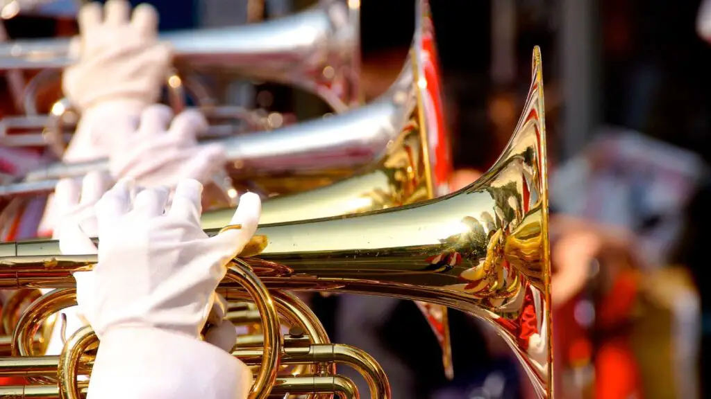 Marching band horn players close up of gloved hands. 